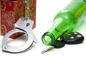 handcuffs, bottle, keys of repeat offender