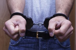 man resisting handcuffs