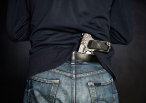 Man with a gun in his belt