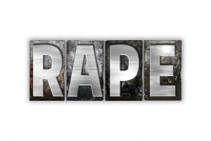 Rape signage in black and white blocks.