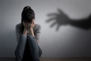 A woman experiencing the long term effects of sexual abuse.